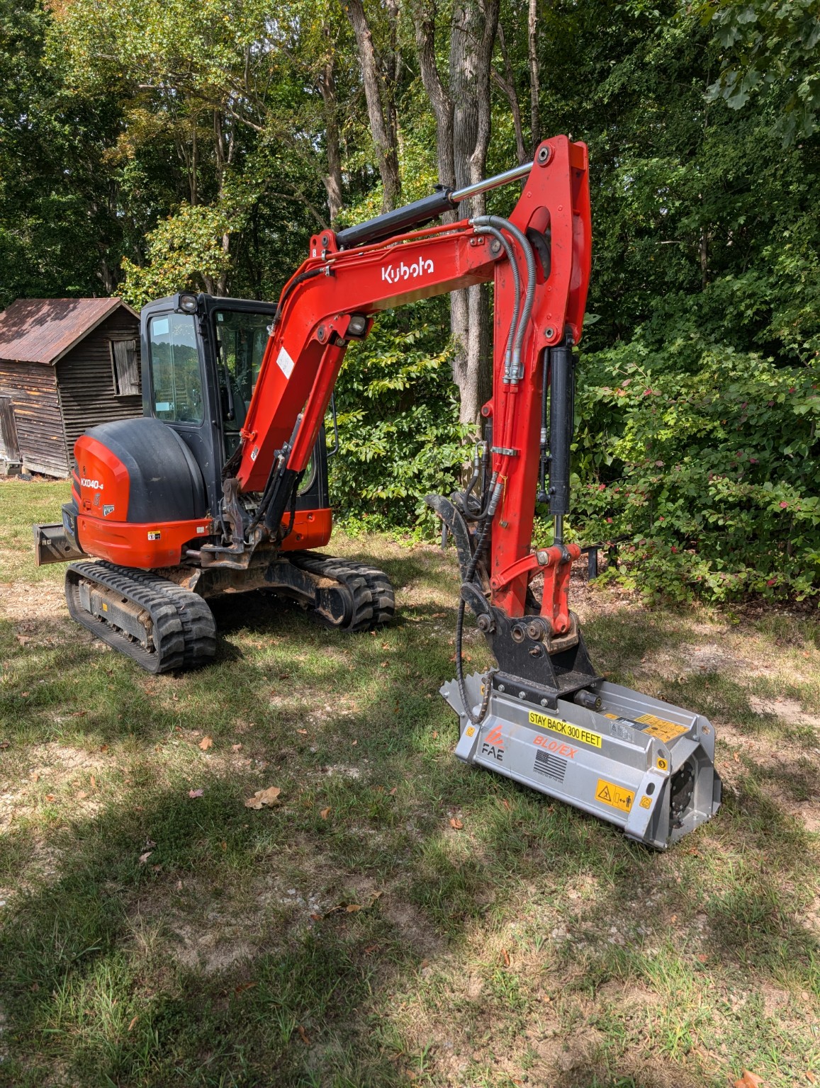 Kubota mini excavator with a mulching attachment